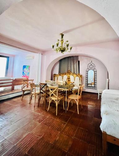 a dining room with a table and chairs at El Beaterio Apartments in Tarifa