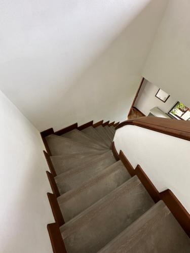 a staircase in a room with a stair case at Villa Santatrada23 in Villa San Giovanni