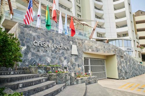 a sign in front of a building with flags at Casa Andina Premium Golf Los Incas in Lima
