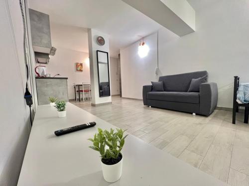 a living room with a couch and a table at Abruzzi Home in Cologno Monzese