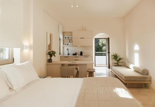 A bed or beds in a room at Ariadne Suites