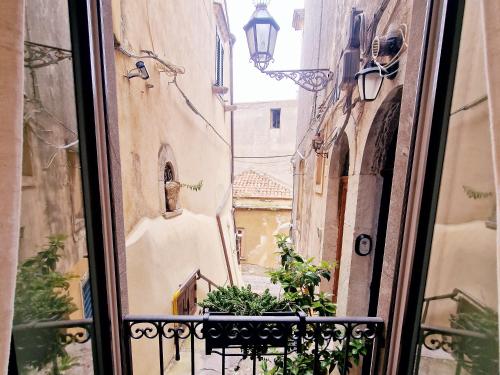 a view of an alley from a window at Donna Rosa - Main Avenue in Taormina