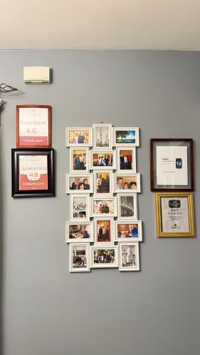 a group of photos on a wall with pictures at Adorable 2-bedroom unit with jacuzzi beside falls in Niagara Falls