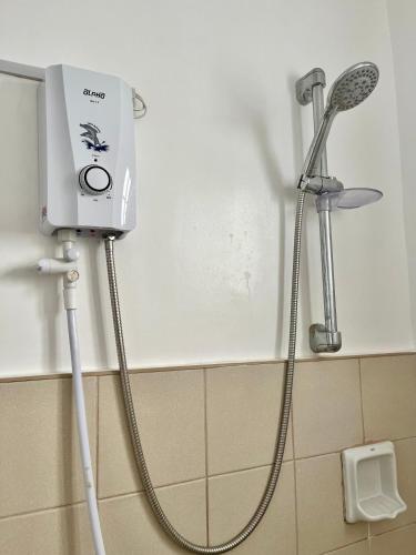 a shower in a bathroom with a shower at Comfort Zone in Dao
