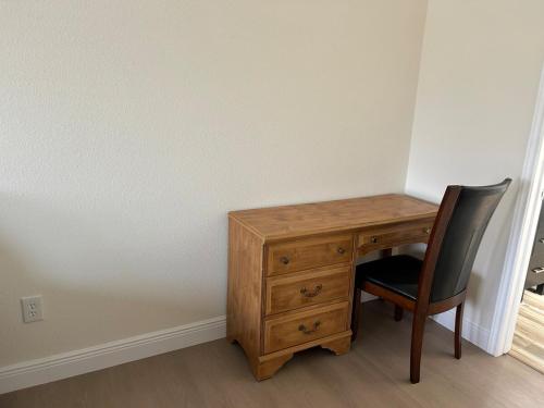a wooden desk with a chair and a wooden drawer at New 2025 Modern 3BR Retreat in Canyon Lake