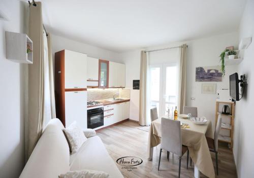 a living room with a white couch and a table at La Casetta in Tuglie