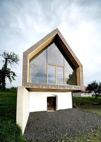 a small house with a large window on top at LandLoft in the Sausal wine region in Gleinstätten