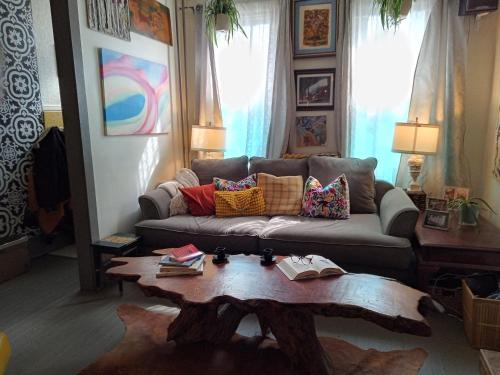 a living room with a couch and a coffee table at Charming Bohemian Rental in Philadelphia