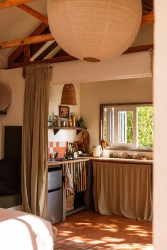 a kitchen with a sink and a counter top at The Casita at La Casa Cubo in Torquay