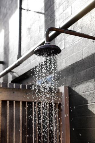 a shower with water coming out of it at The Casita at La Casa Cubo in Torquay