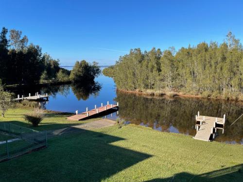 a view of a lake with a dock and trees at BasinWaterStays Waterfront Jetty - Brm2 in Basin View