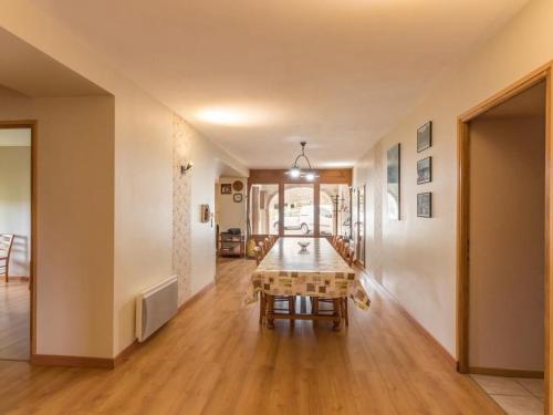 a dining room with a table in a room at Gîte Vosges : nature, cheminée, animaux acceptés - FR-1-583-379 in Corravillers