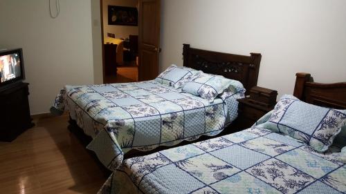Ένα ή περισσότερα κρεβάτια σε δωμάτιο στο Apartamento Los Delfines del Caribe