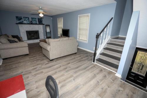 a living room with a couch and a fireplace at 4Bedroom 3Bath Home Near Fort Jackson in Columbia