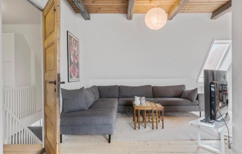 a living room with a couch and a table at Lovely Home In Lemvig With Wifi in Lemvig