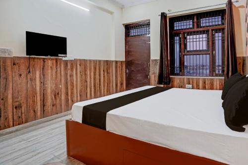 Postel nebo postele na pokoji v ubytování Super Hotel O Nand Palace