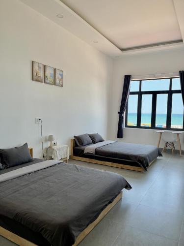 Ένα ή περισσότερα κρεβάτια σε δωμάτιο στο Mơ Homestay - View Biển Ninh Thuận