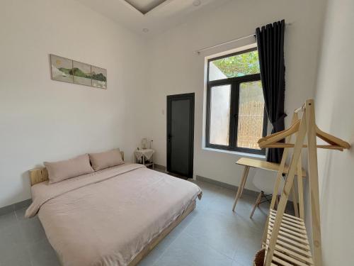 Ένα ή περισσότερα κρεβάτια σε δωμάτιο στο Mơ Homestay - View Biển Ninh Thuận