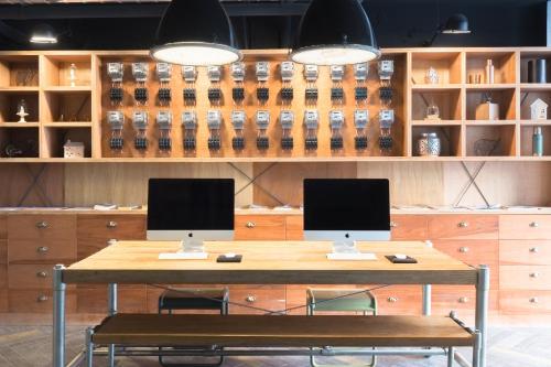 two monitors sitting on a table in a room at ART'OTEL Ximending TAIPEI in Taipei