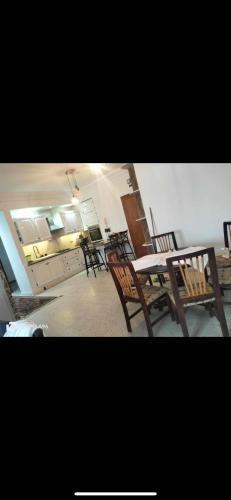 a group of chairs and tables in a room at Marina in Akouda