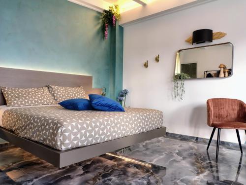 En eller flere senge i et værelse på Villa Baia dei Gruccioni