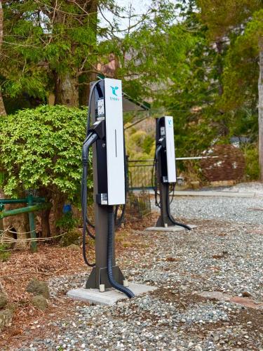 two black and white pay phones in a park at 美術の宿 箱根もみじの森 in Hakone