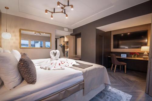 a hotel room with a large bed and a desk at Solo Sokos Hotel Lahden Seurahuone in Lahti