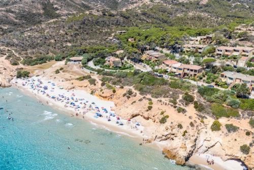 an aerial view of a beach with umbrellas and the ocean at Augusto's House in Fort Village