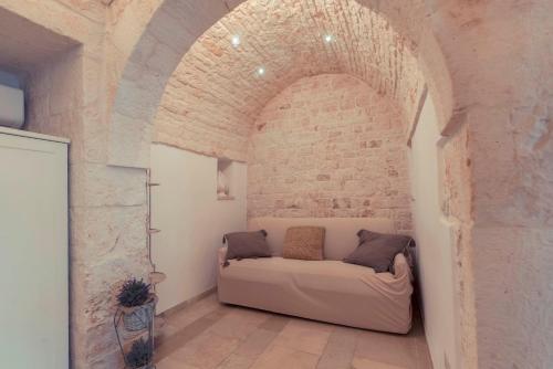 Area soggiorno di Widespread Trulli in the historic center - Trulli Antichi Mestieri