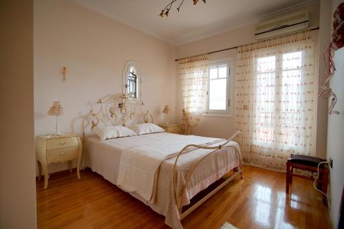 Ένα ή περισσότερα κρεβάτια σε δωμάτιο στο Stylish Villa in Messinia