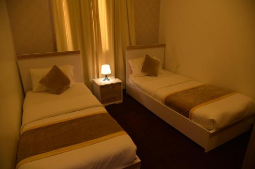 Ένα ή περισσότερα κρεβάτια σε δωμάτιο στο Dahlia Hotel Apartment Riggae