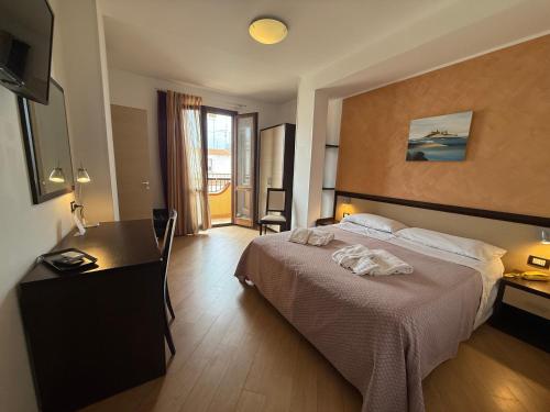 Cama o camas de una habitación en Albergo Perseo