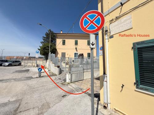 a street sign on the side of a building at Raffaello's House - Aeroporto Falconara - Ancona in Ancona Falconara Airport
