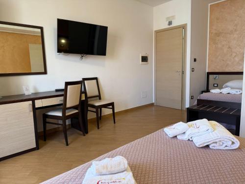 Cama o camas de una habitación en Albergo Perseo