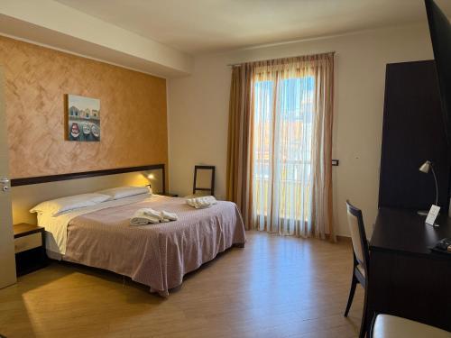 Cama o camas de una habitación en Albergo Perseo