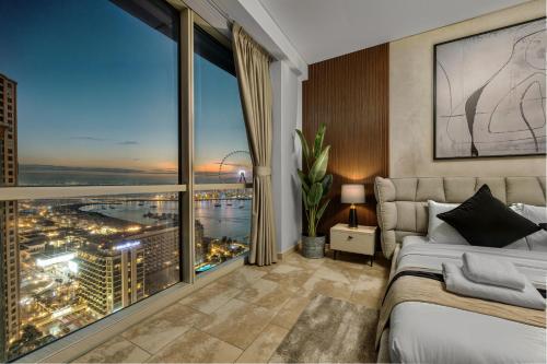 a bedroom with a view of a city at JBR Coastal Escape - Amazing Sea Views, Pool & State-of-the-Art Gym in Dubai