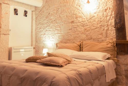 Letto o letti in una camera di Widespread Trulli in the historic center - Trulli Antichi Mestieri