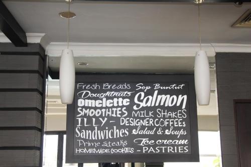 a sign hanging from the ceiling of a restaurant at Swiss-Belhotel Borneo Samarinda in Samarinda