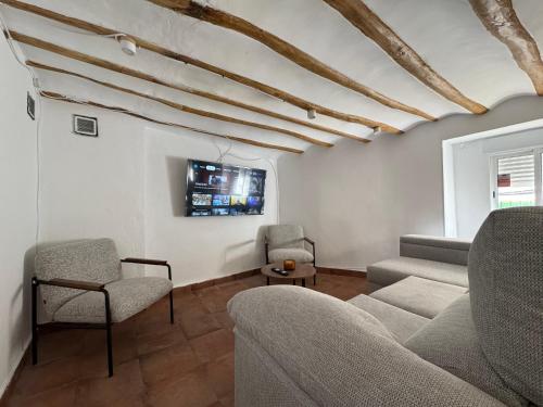 TV a/nebo společenská místnost v ubytování Casa Kiona