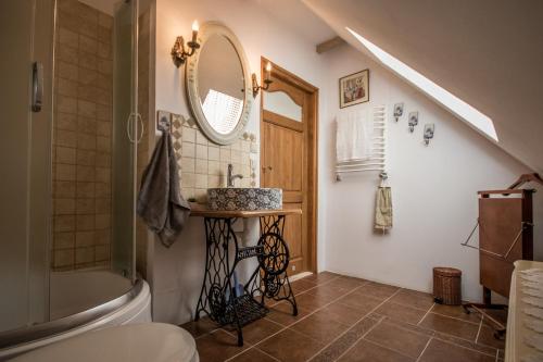 a bathroom with a sink and a mirror at Dom pod Skrzydłami in Gawliki Wielkie