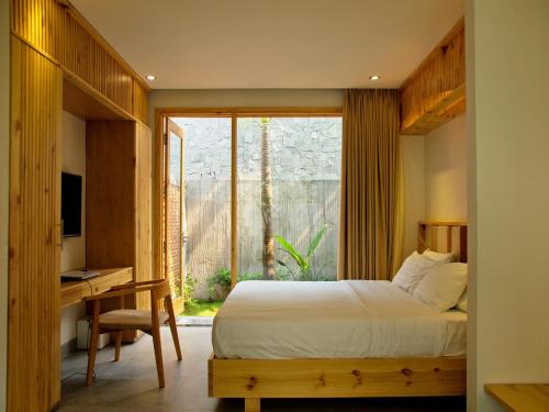 Postel nebo postele na pokoji v ubytování Carol Villa Da nang Beach 2