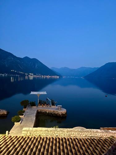a view of a lake with mountains in the background at Casa Pantagana in Kotor