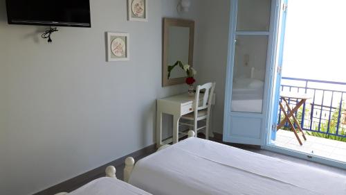 Postel nebo postele na pokoji v ubytování Minoa Hotel