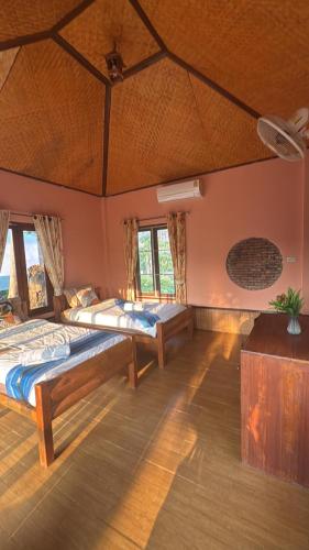 a large room with two beds in it at The Nest, Pai Love Resort in Thung Yao