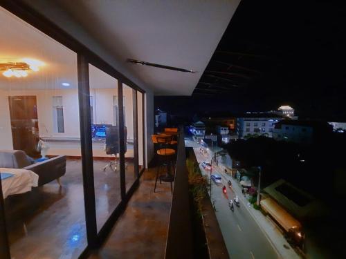 a living room with a view of a city at Angkor Legacy Boutique in Siem Reap