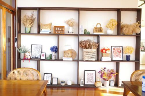 a room with a shelf filled with wicker baskets at Your Home AYUTTHAYA in Phra Nakhon Si Ayutthaya