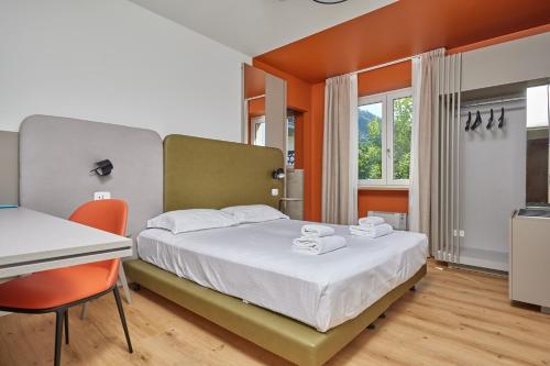 Postel nebo postele na pokoji v ubytování Hotel San Carlo