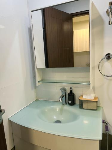 a bathroom with a sink and a mirror at Oyasumi Condotel with balcony-Megatowers 1 Near Session, SM, Burnham park, Baguio City in Baguio