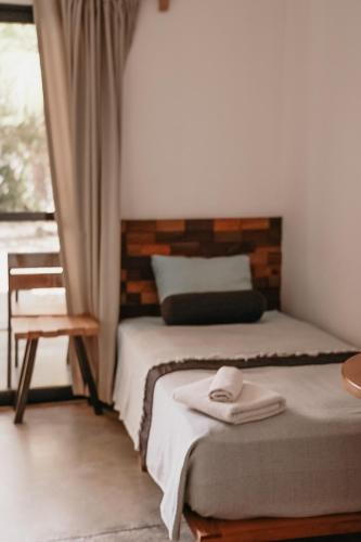 Кровать или кровати в номере Surf And Yoga Retreat Nicaragua