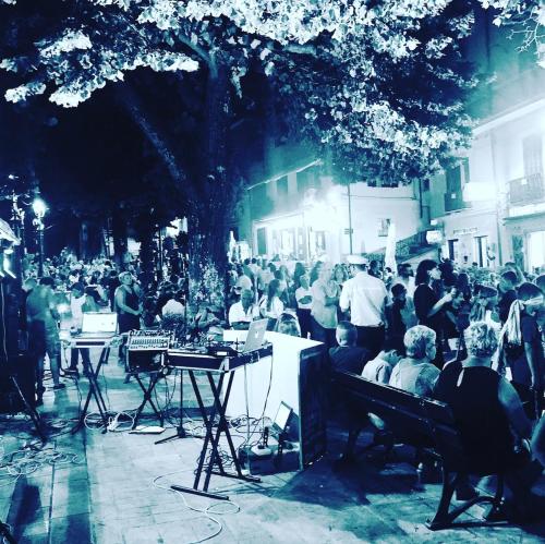 a crowd of people on a city street at night at Sea View - Private House with Garden in Pisciotta in Caprioli